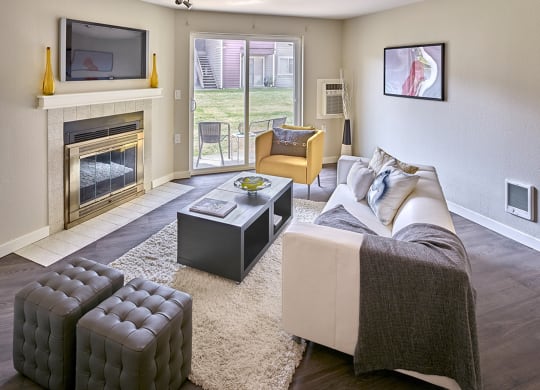 a living room with a fireplace and a couch at Quartz Creek, Mountlake Terrace, WA, 98043