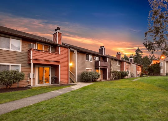 a row of houses on a city street at sunset at Quartz Creek, Washington, 98043
