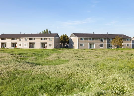 a row of apartment buildings in a field at Shiloh Glen, Billings