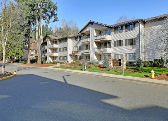 an empty street in front of an apartment building  at Townside Flats, Redmond, Washington