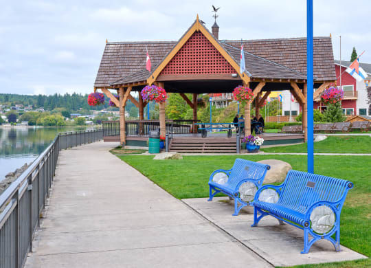 a park with benches and a gazebo near the water at Woodcreek, Poulsbo, 98370