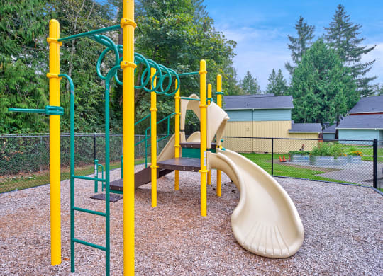 our playground is equipped with a swing set and slides at Woodcreek, Washington