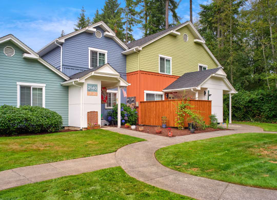 a group of houses with a sidewalk in front of a yard at Woodcreek, Poulsbo, WA 98370
