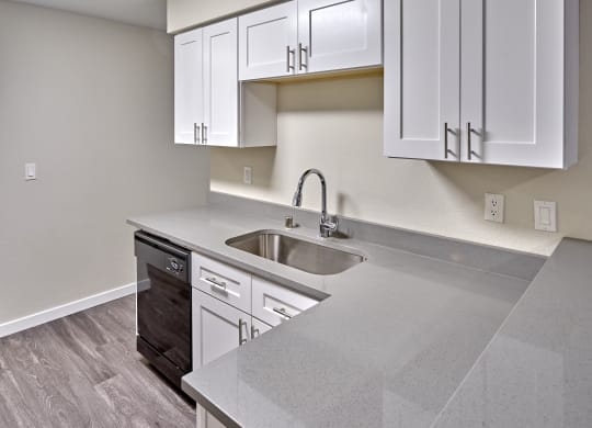 Kitchen with appliances and cabinets at Arterra Apartments, Kent, WA, 98030