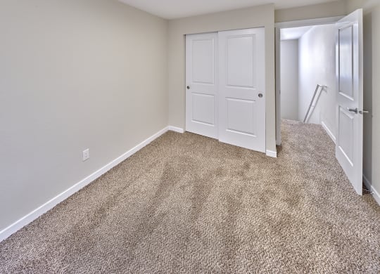 Bedroom area with wooden flooring at Arterra Apartments, Kent, Washington