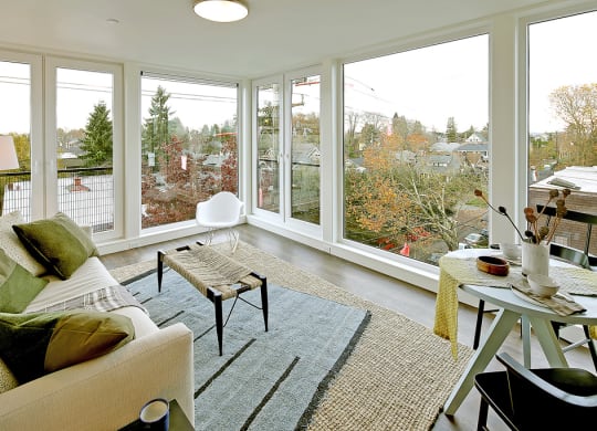 Living room with view of city and trees.at 19th & Mercer, Seattle, 98112