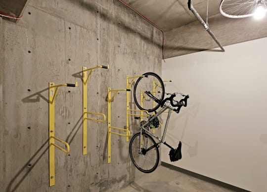 Community bike storage room with bike hanging on wall.at 19th & Mercer, Seattle, 98112