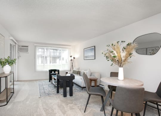 a living room with a couch and a table and chairs  at Brix, Washington