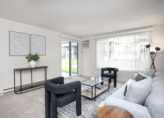 a living room with a couch and chairs and a coffee table  at Brix, Washington