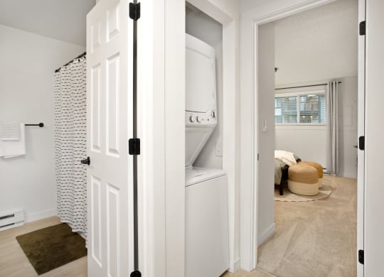 an open closet with a washer and dryer in a home at Brix, Walla Walla