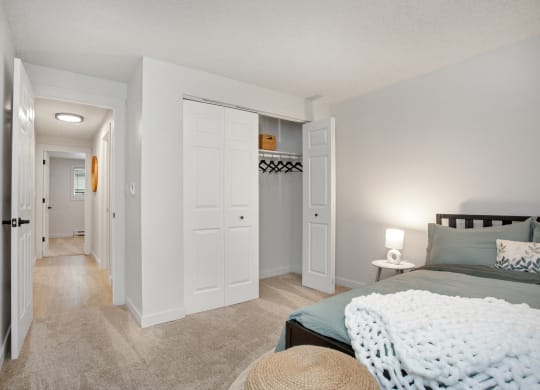 a bedroom with a bed and a hallway with closets at Brix, Walla Walla, WA, 99362