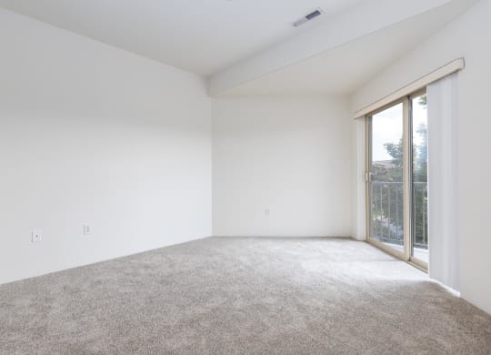 a room with carpet and a window  at Shoreline Village, Richland, WA