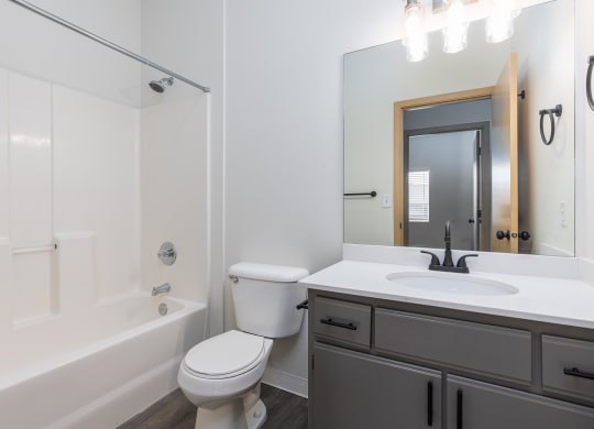 a bathroom with a sink toilet and a bath tub  at Shoreline Village, Richland, WA, 99352