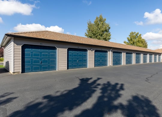 a long row of garages with blue garage doors  at Shoreline Village, Richland, WA, 99352