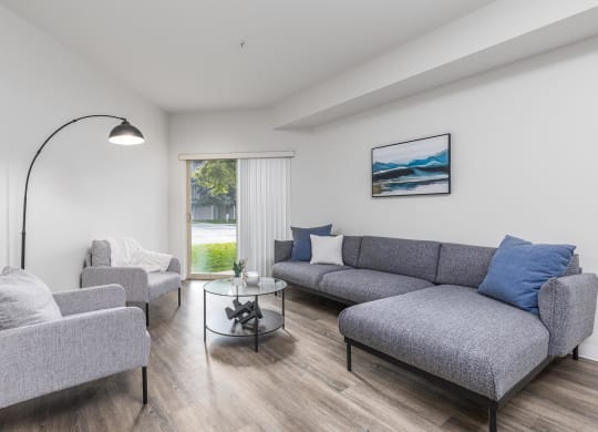 a living room with a couch and two chairs  at Shoreline Village, Washington