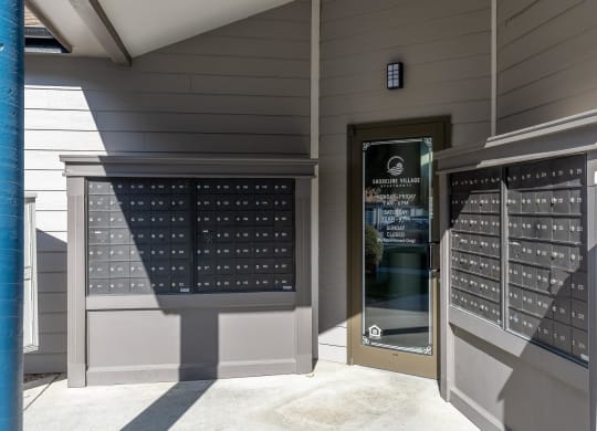 a door to a building with a display of wine glasses  at Shoreline Village, Richland, WA