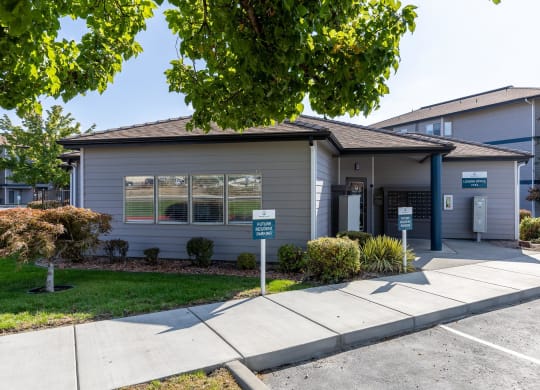 a small gray house with a sidewalk in front of it  at Shoreline Village, Washington