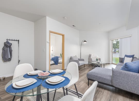 a living room with a table and chairs and a couch  at Shoreline Village, Richland, WA