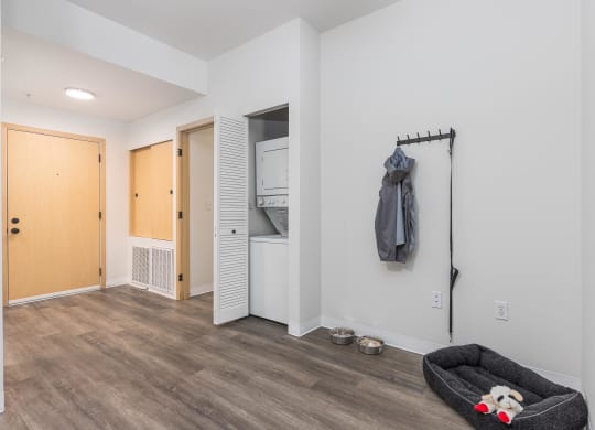 a living room with a couch and a door to a closet  at Shoreline Village, Washington