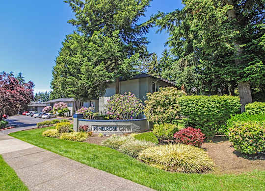 A residential area with a house and a sign that says