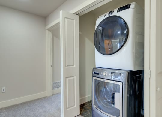 an empty laundry room with a washer and dryer at Copper Pines, Bozeman, MT, 59718