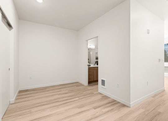 a living room with white walls and wood floors g room with white walls and wood floors at The Duo, University Place Washington
