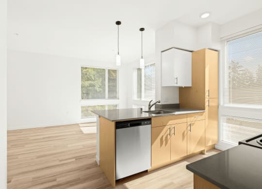 a kitchen with an island and a window at The Duo, University Place, WA 98466
