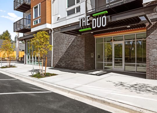 a building with a sign that reads the duo on the front of it at The Duo, Washington, 98466