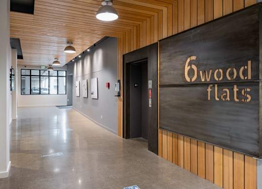 A hallway with a sign that says