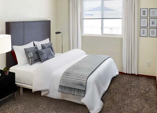 a bedroom with a bed and a window with red curtains at Shiloh Glen, Montana