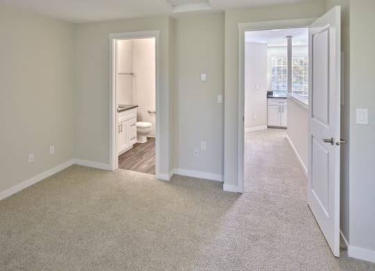 an empty bedroom and bathroom with a door open to the living room at Edmonds Gateway, Edmonds, WA 98026