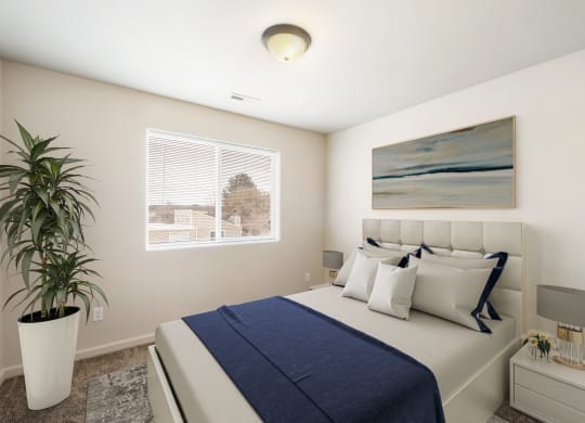 A furnished bedroom with a large window, gray carpets, and overhead lighting. Stayed with queen-size bed, side tables, and a house plant. at Pine Tree Park, Kennewick, 99337