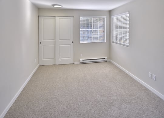 an empty room with a door and a window at Edmonds Gateway, Edmonds, WA
