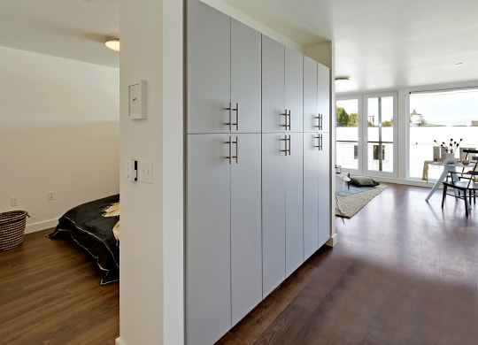 Build-in hallway storage with bedroom and living room visible in the distance at 19th & Mercer, Seattle Washington