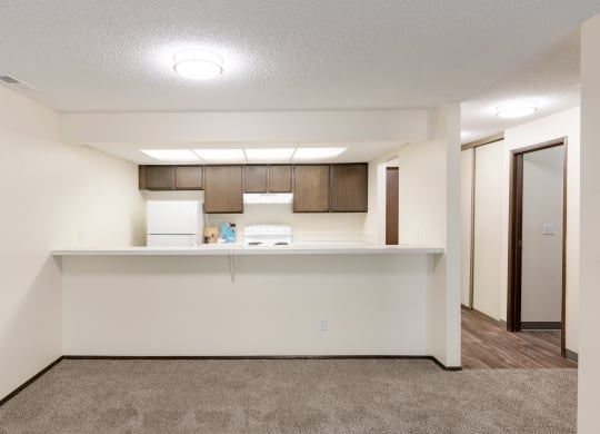 the living room and kitchen of a 560 sq ft apartment