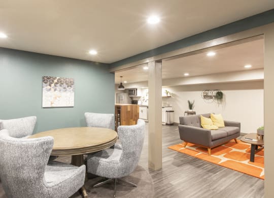 Updated lounge with game table, couch and kitchen.at Cedarwood, Wenatchee, WA 98801