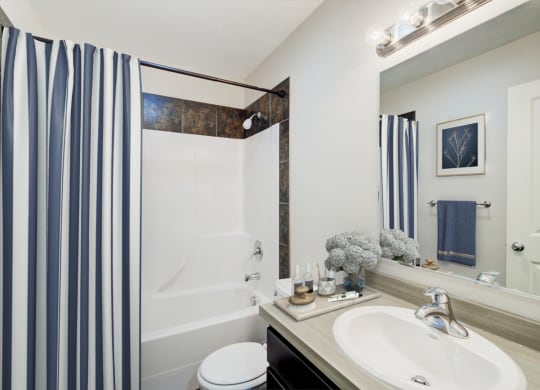 a bathroom with a shower and a sink and a mirror at Copper Pines, Bozeman, MT, 59718