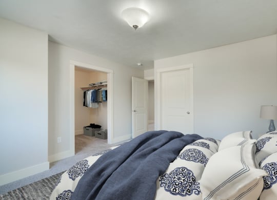 a bedroom with a bed and a closet at Copper Pines, Bozeman, MT