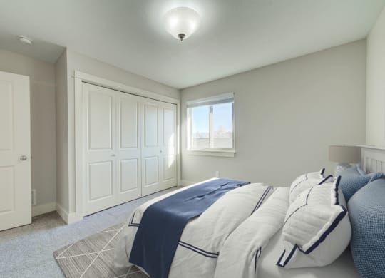 a bedroom with a bed and a window at Copper Pines, Bozeman, MT 