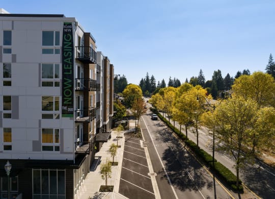 an aerial view of a city street with buildings and trees at The Duo, University Place, WA 98466 