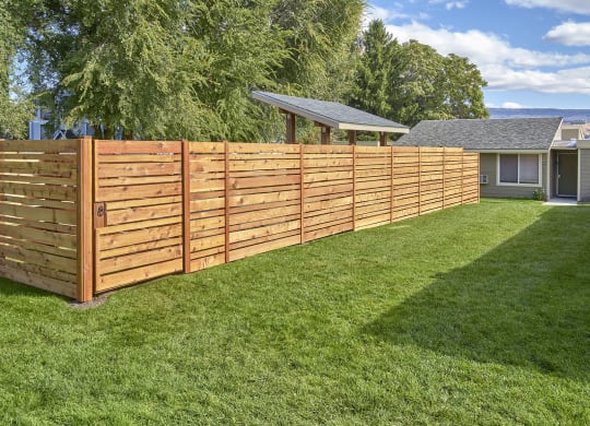 Well maintained, grassy dog run area.at Park View Apartments, Wenatchee, WA