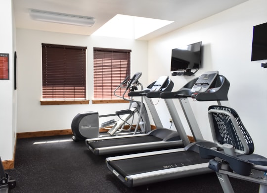 the gym has a lot of exercise equipment  at Quail Springs, West Richland, 99353
