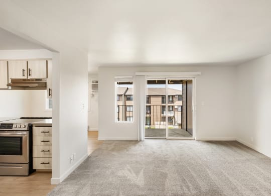 an empty living room with a kitchen to the left  at Brix, Walla Walla, WA, 99362