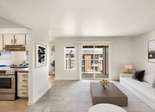 a living room with a white couch and coffee table  at Brix, Walla 