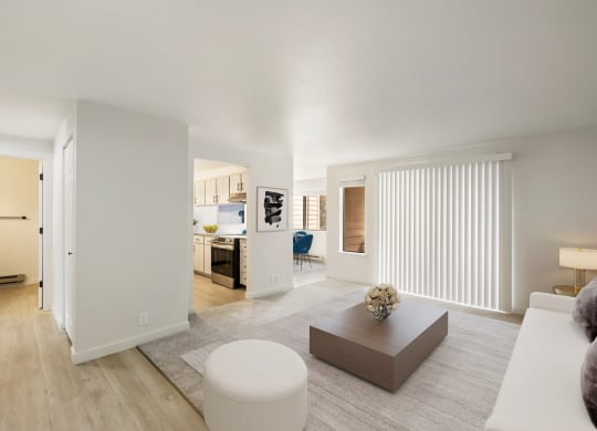 a spacious living room with white walls and hardwood floors  at Brix, Washington