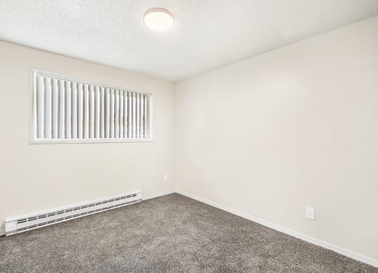 a bedroom with a window and carpet at Wildflower, Kennewick, 99336