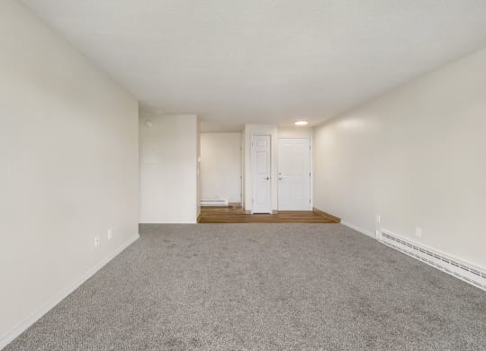 a spacious living room with white walls and carpet at Wildflower, Washington, 99336