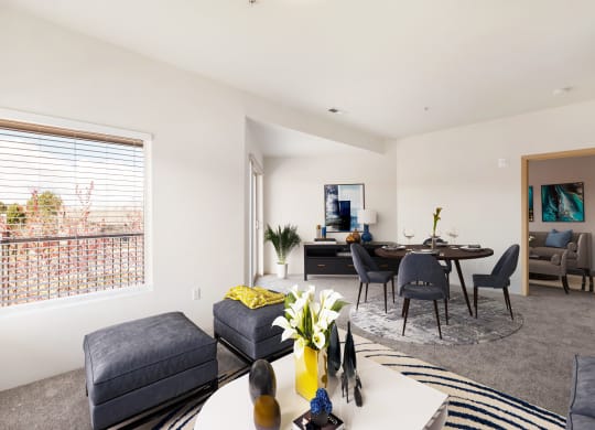 a living room and dining room with a large window. at Shoreline Village, Richland, 99352