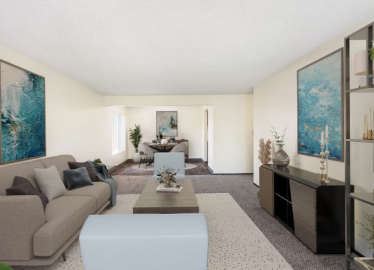 a living room with a couch coffee table and a dining room table in the background at Castlerock, Wenatchee Washington