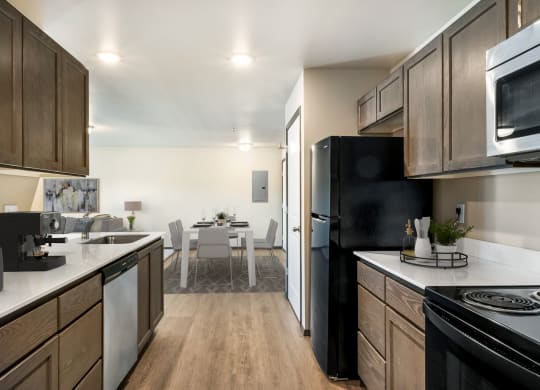 a kitchen and dining area in a 555 waverly unit  at Altitude, East Wenatchee, Washington